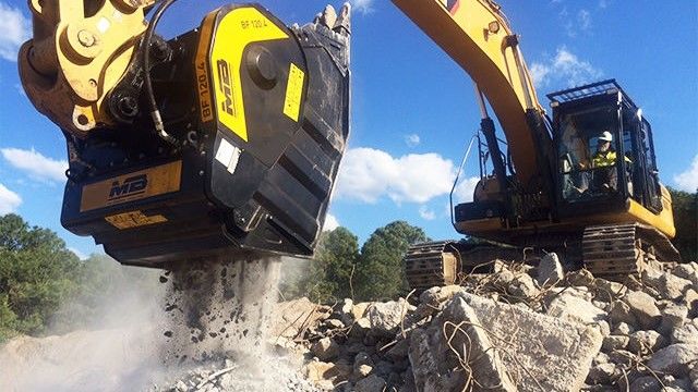 BF120.4 on a Caterpillar crushing reinforced concrete.